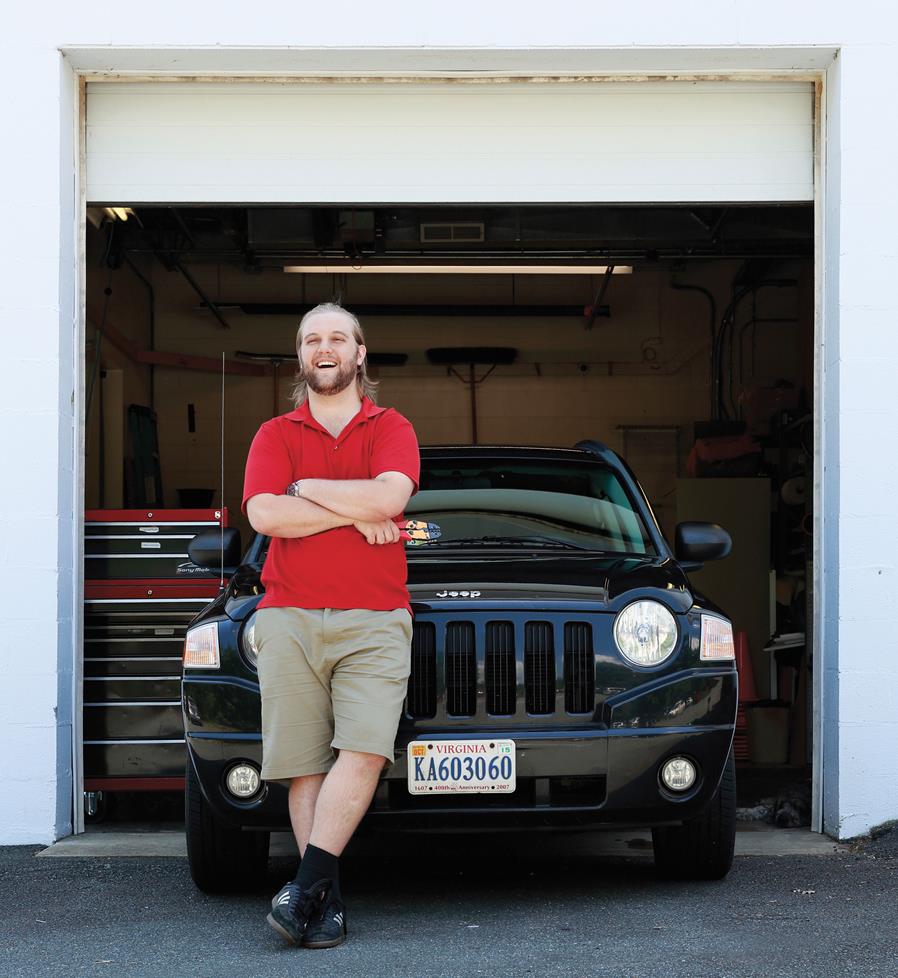 Otis in front of his 2010 Compass