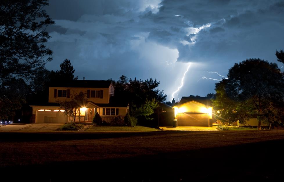 Lightning striking near house