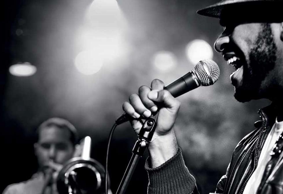 Singer on stage with a dynamic microphone