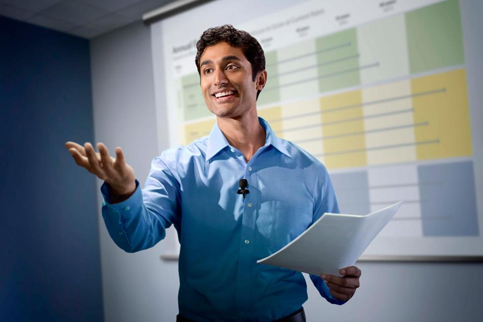 Businessman giving presentation wearing lavalier microphone