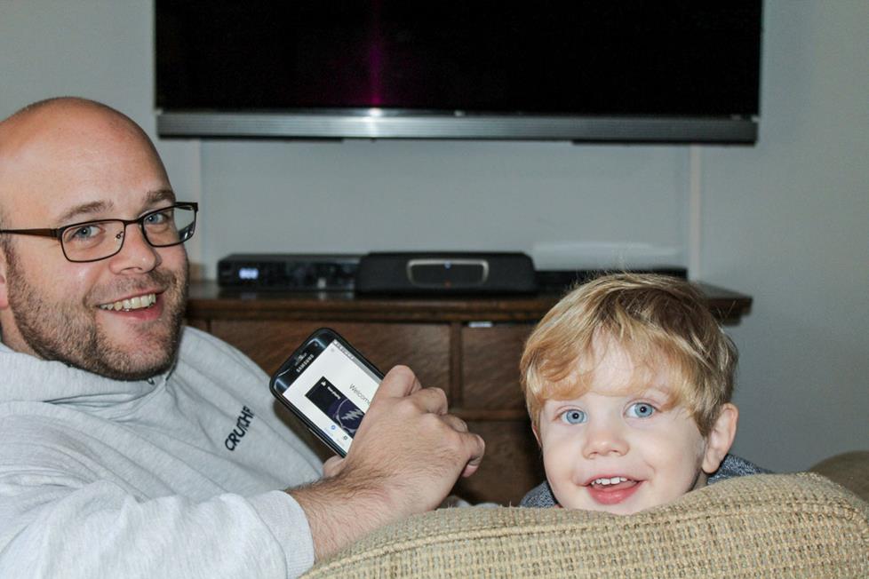 The author at home his his son