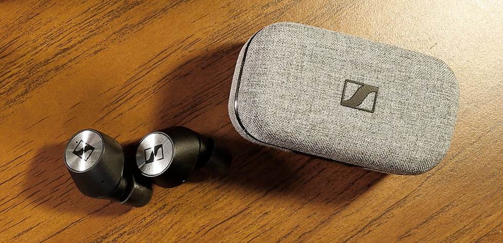 True wireless earphones with case on desk