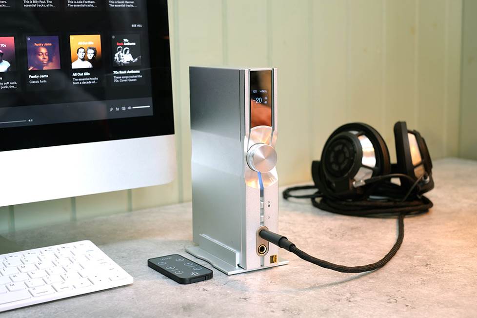 DAC/headphone amp on desk next to computer