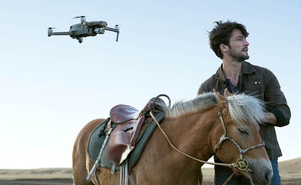 drone flying over a man and his horse