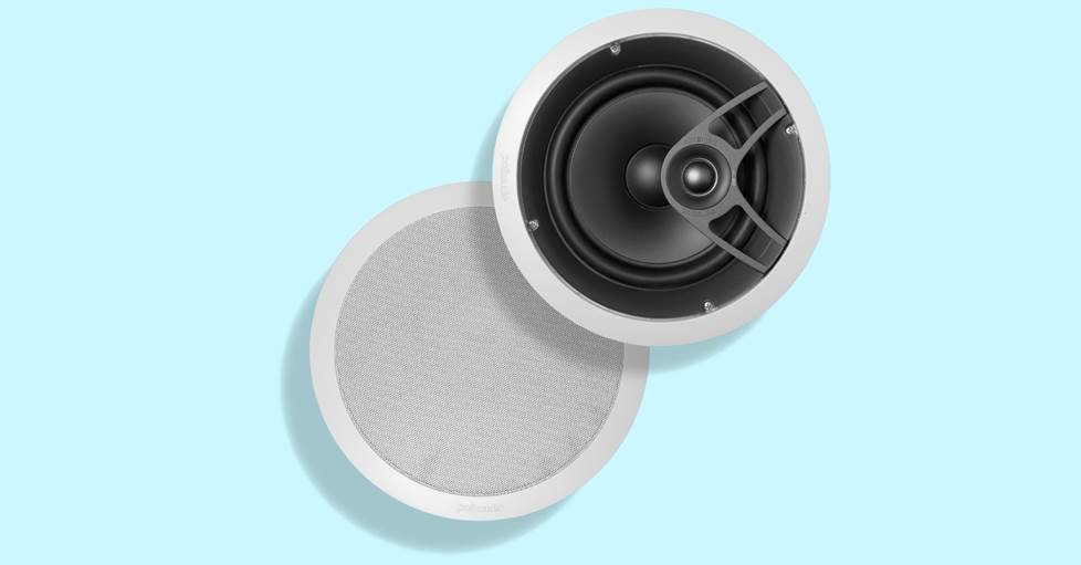 An in-ceiling speaker on a blue background.