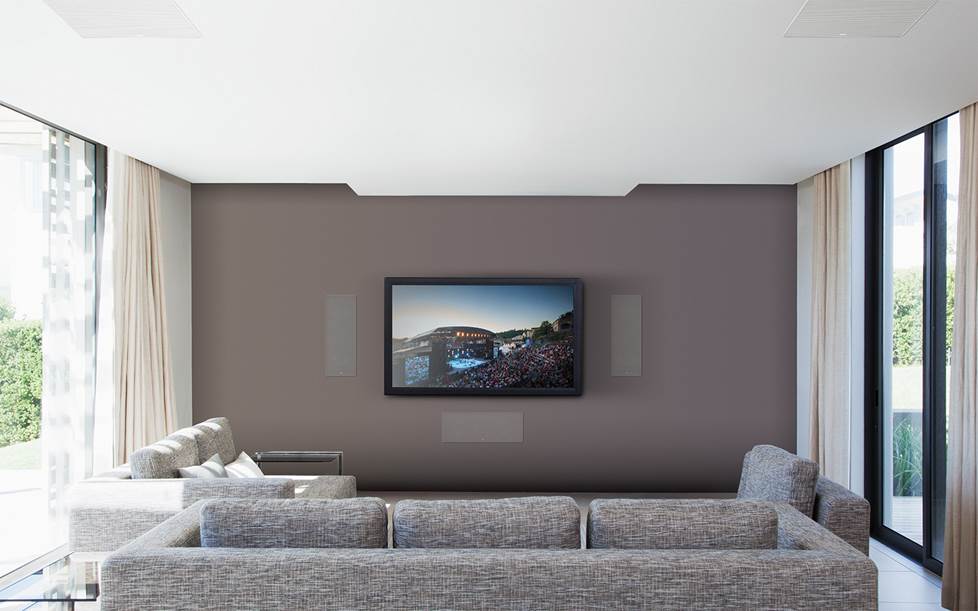 Home theater setup with in-wall and in-ceiling speakers.