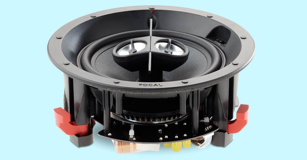 An in-ceiling speaker on a blue background