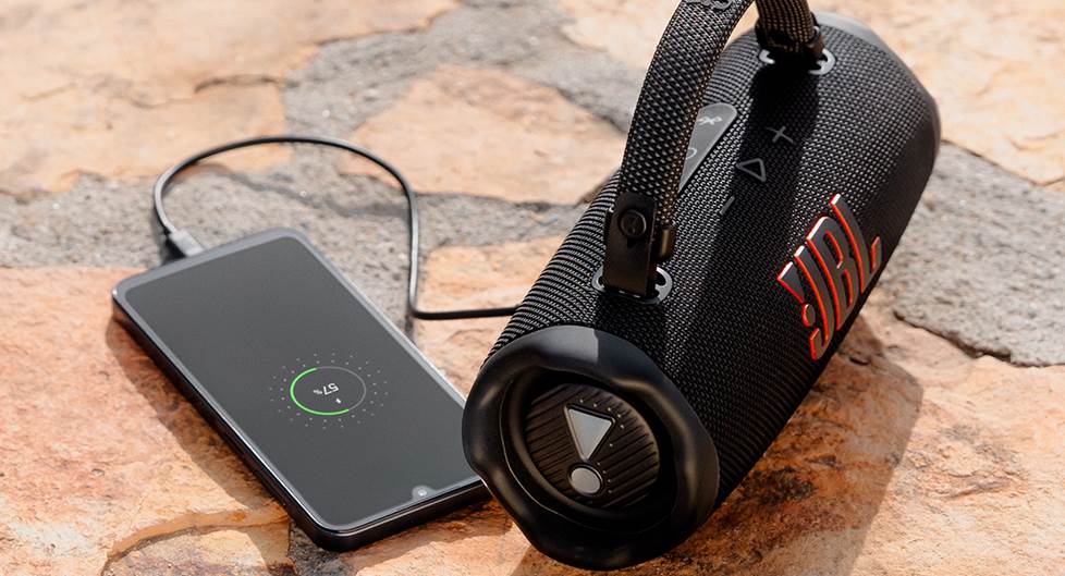 JBL Charge 5 with built in power bank charging a phone.