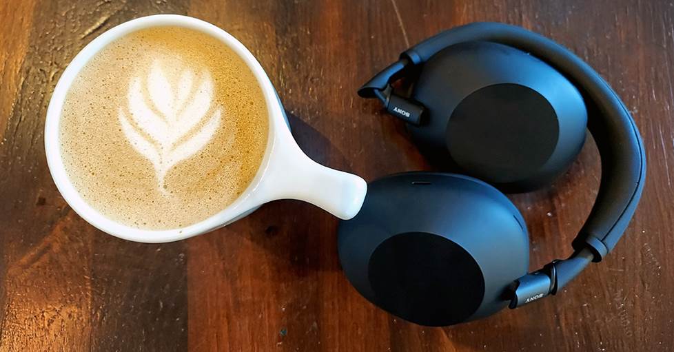 Sony XM6 headphones shown folded on table