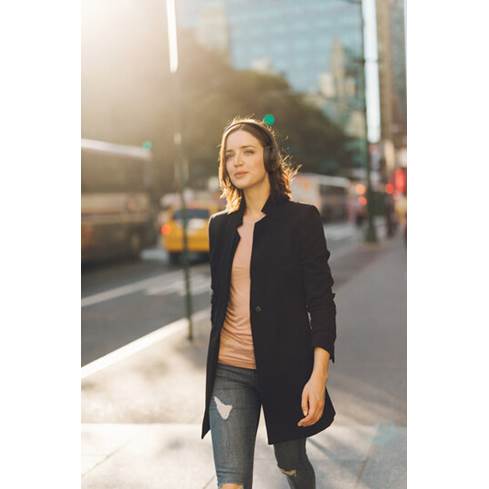 Woman wearing JBL Tune 750NC headphones