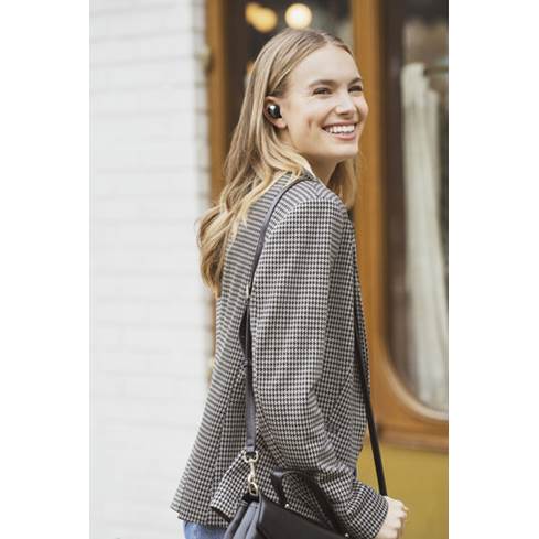 Woman wearing JBL Club Pro+ TWS earbuds
