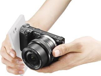 Just a quick tap initiates the Sony Alpha NEX-5T's communication via NFC (smartphone and lens not included)