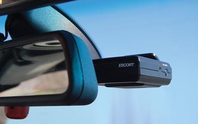 Escort SmartRadar radar detector behind rear-view mirror
