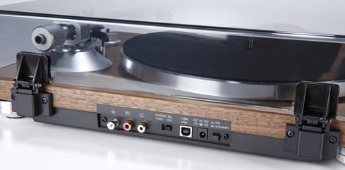 The turntable's built-in phono preamp allows you to plug directly into the powered speakers with no need for a receiver in-between.