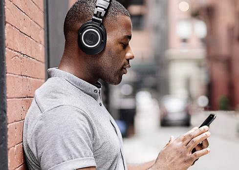 Man wearing Audio-Technica ATH-M50XBT
