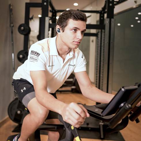 Lando Norris wearing Klipsch T5 II True Wireless Sport McLaren edition.