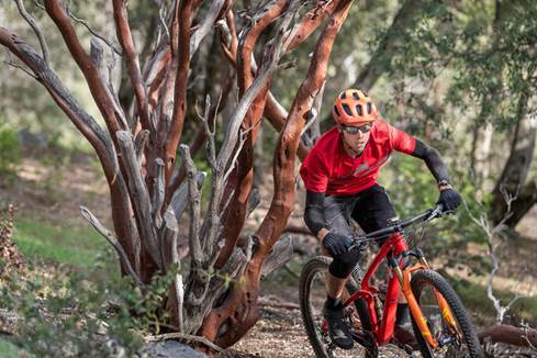 Man cycling wearing Bose Frames