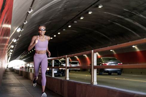 Woman wearing Bose Frames while running