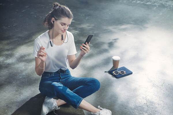 Woman wearing Sony WI-XB400 EXTRA BASS neckband earbuds