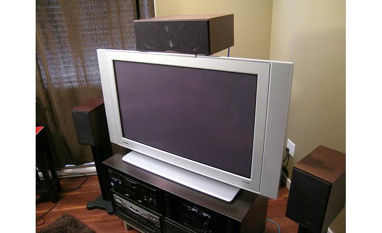 Center Stage Bracket CSB-1206-BLK Shown attached to TV (speaker not included)