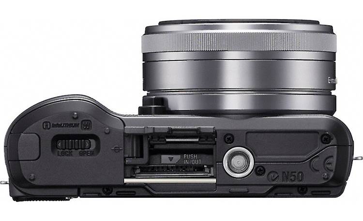 Sony Alpha NEXC3A Bottom view, with lens attached and memory card slot open