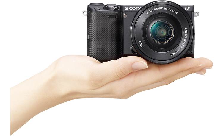 Sony Alpha NEX-5T 3X Zoom Lens Kit Shown in hand for scale