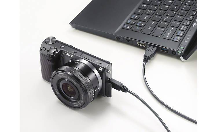 Sony Alpha NEX-5T 3X Zoom Lens Kit Shown attached to a laptop (not included)