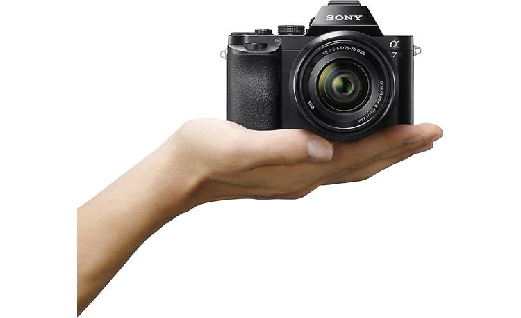 Sony Alpha a7 (no lens included) Shown in hand for scale (lens not included)