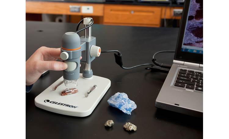 Celestron Handheld Digital Microscope Pro Shown connected to laptop computer using included USB cable (computer not included)