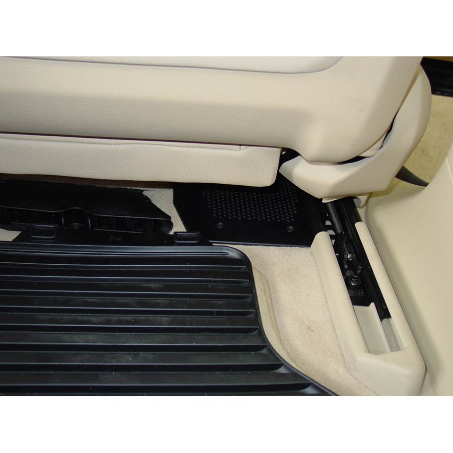 2007 BMW X5 Under front seat speaker location