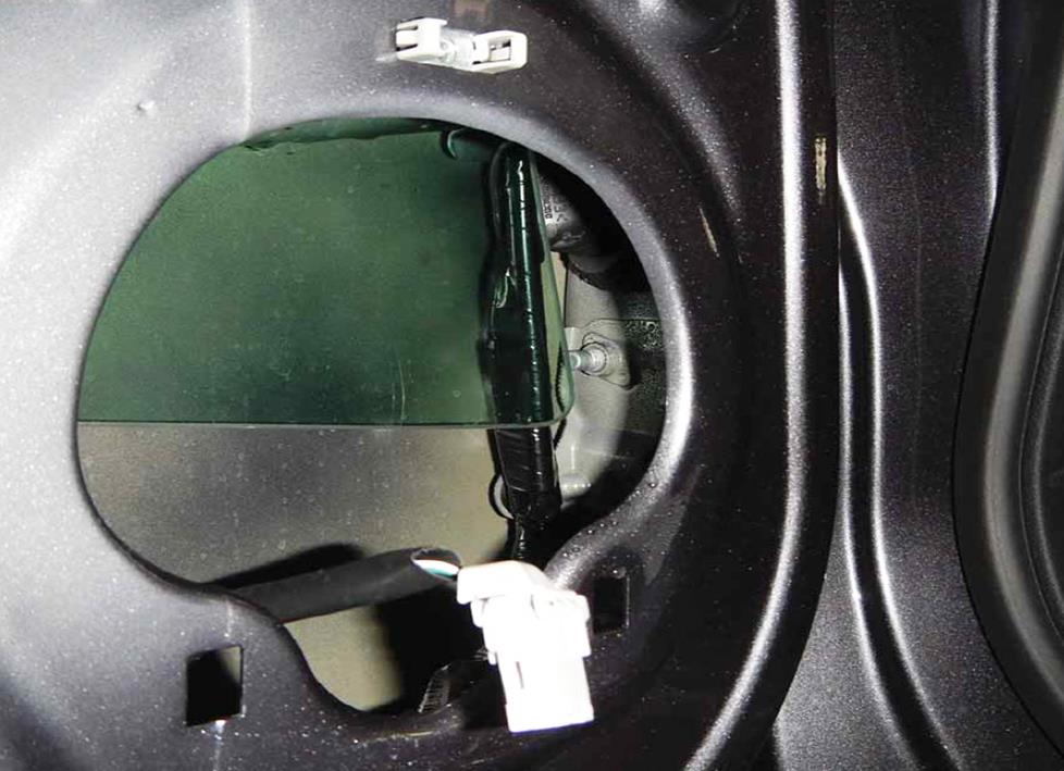 Speaker opening in a car door.