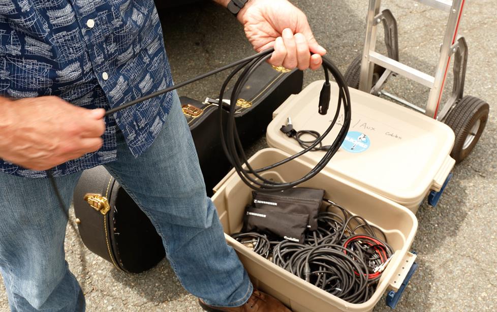 The author rolling cables into neat coils