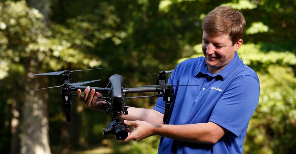 Crutchfield sales advisor Buck with a professional drone