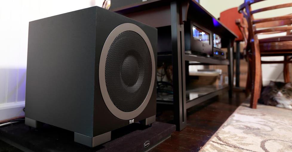 ELAC Debut S10EQ next to a sofa