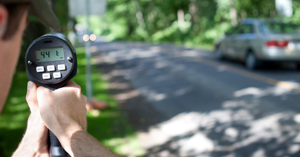 Officer with radar gun