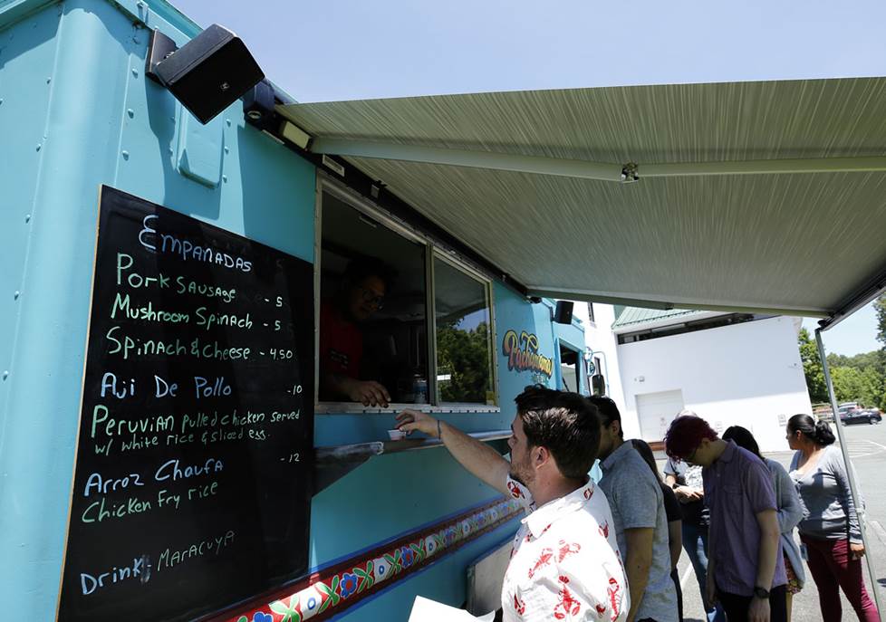 Customers lined up outside the food truck.