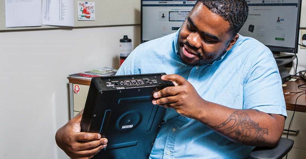 Cam examining the Focal iBus 20 compact powered subwoofer