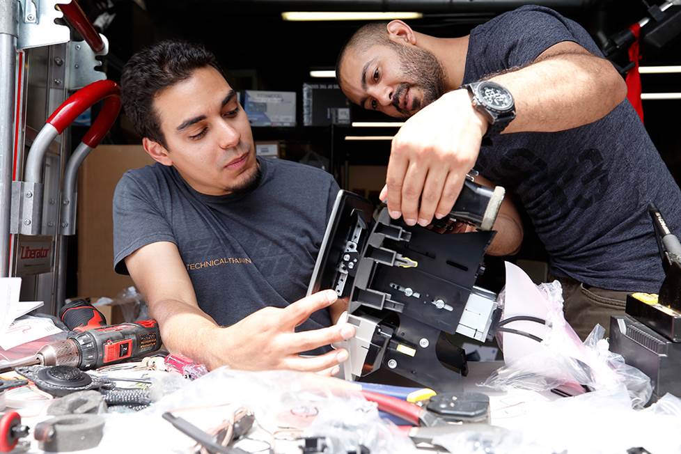 Carlos and Anthony set the angle for the Halo9 receiver's display.