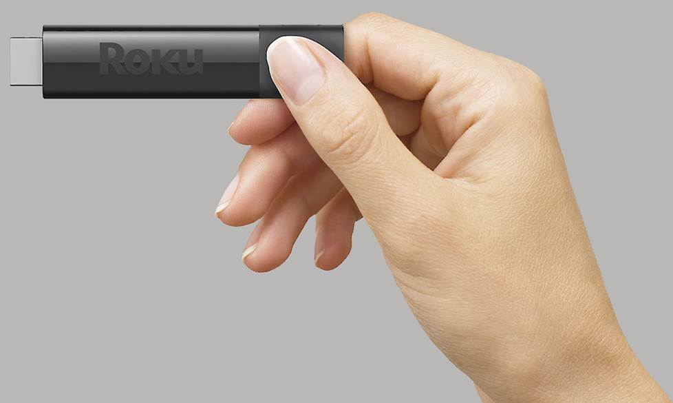 Roku streaming stick in hand