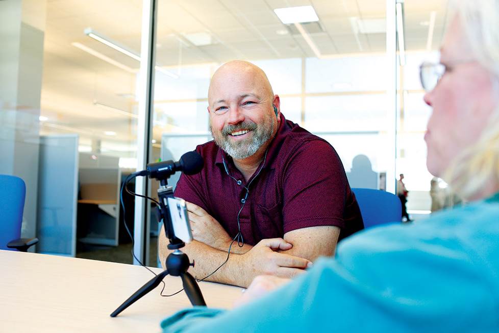 Man conducting interview for podcast