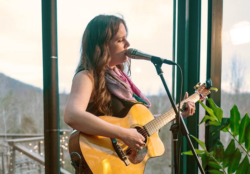 Singer with guitar and microphone