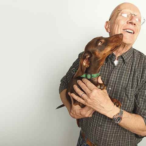 Our CEO, Bill, is a huge animal lover. His buddy Enzo smothers him with kisses during a recent photo shoot.