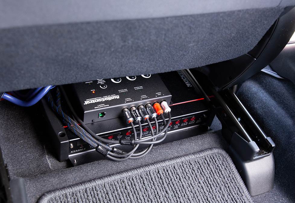 Car amp and line converter under front seat