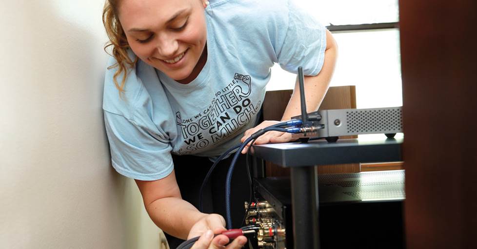 Alexis connecting speakers to a receiver