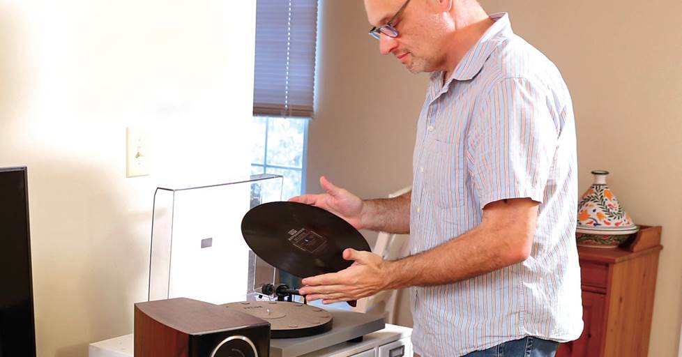 Eric putting an LP record on his turntable