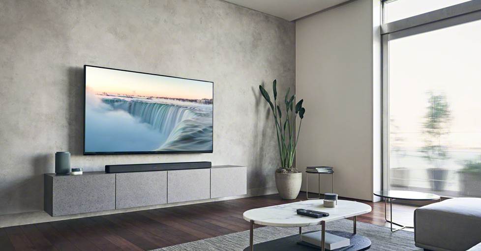 Sony HT-A7000 Powered 7.1.2-channel sound bar system in a living room with a Sony Bravia TV