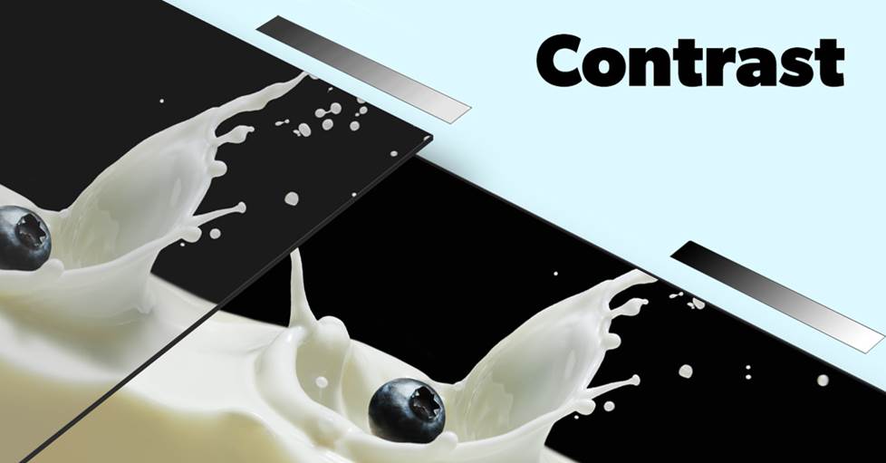 Photo showing a blueberry splashing into milk against a black background