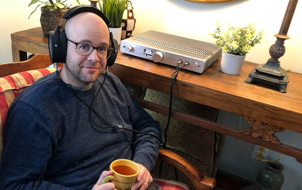 Jeff chilling with headphones and tea