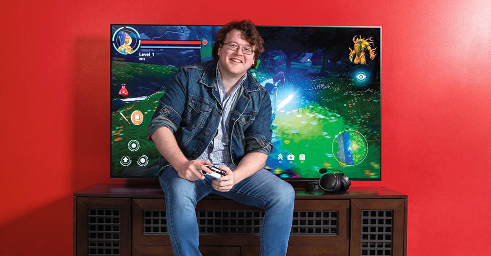 Colin playing video games on a tv with gaming features
