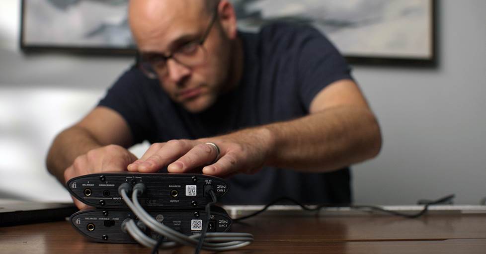 Jeff connecting headphones to an amp